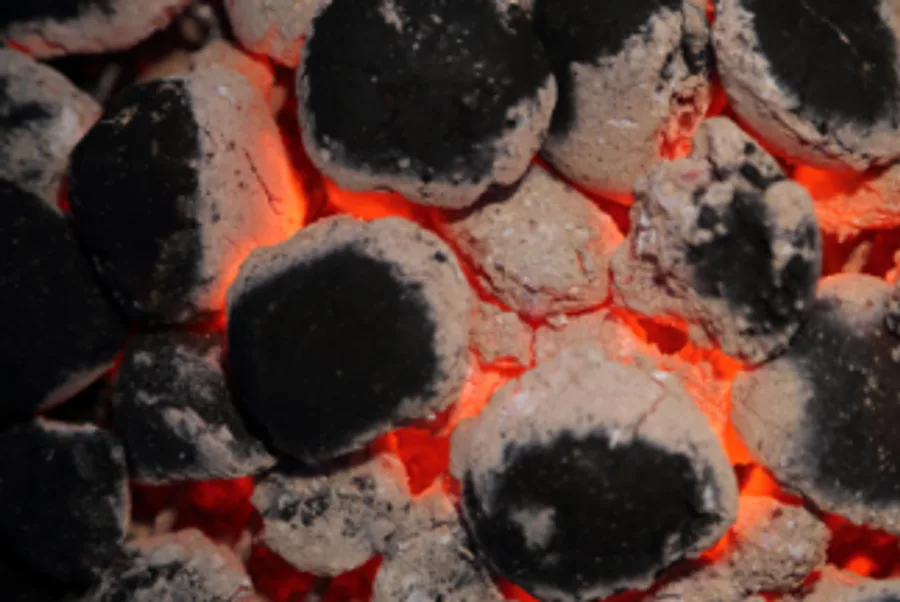 Barbeque briquettes glowing with clean gray-white ash