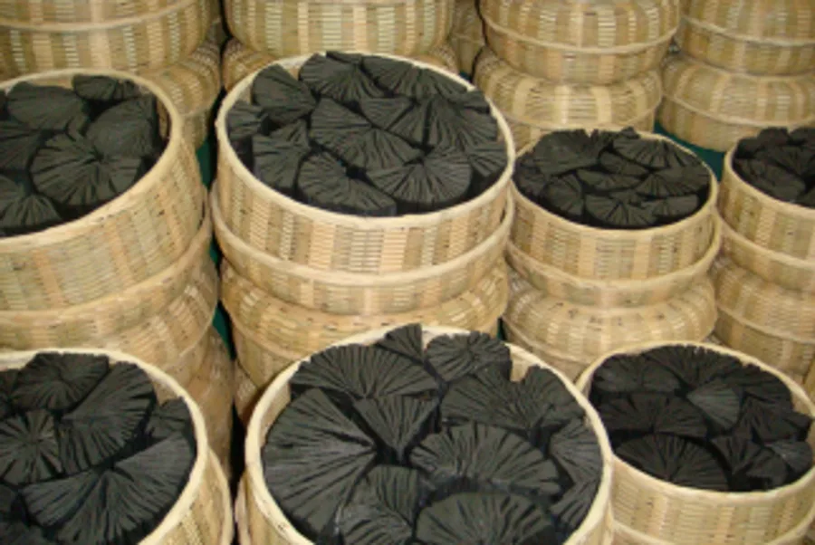 Premium coconut shell charcoal packed in woven baskets